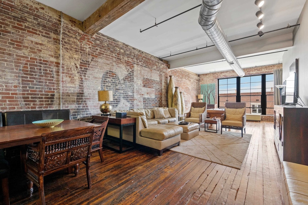 Living room with hardwood / wood-style floors, bea