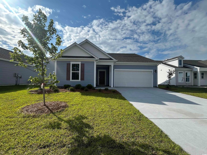 Single story home featuring concrete driveway, an 