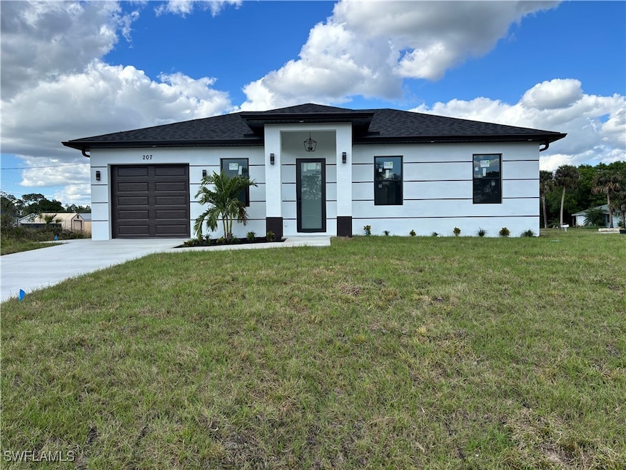 View of front of house featuring a garage and a fr