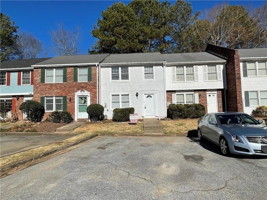 View of property with brick siding
