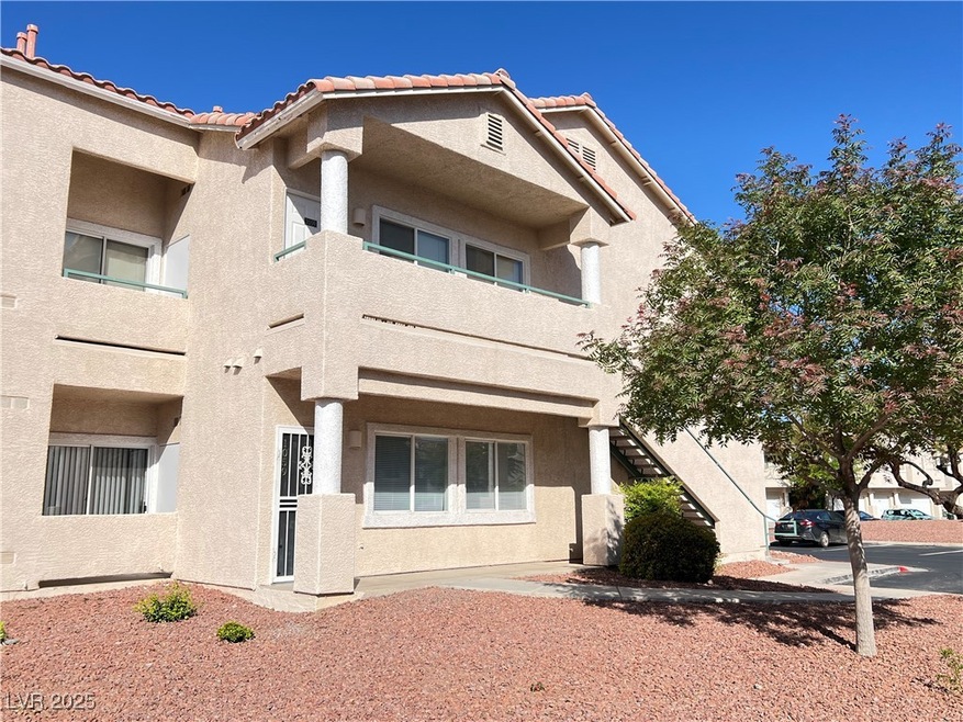 View of front of home featuring stucco siding, a t