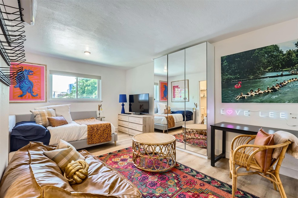 Bedroom featuring light wood-style flooring, a cl
