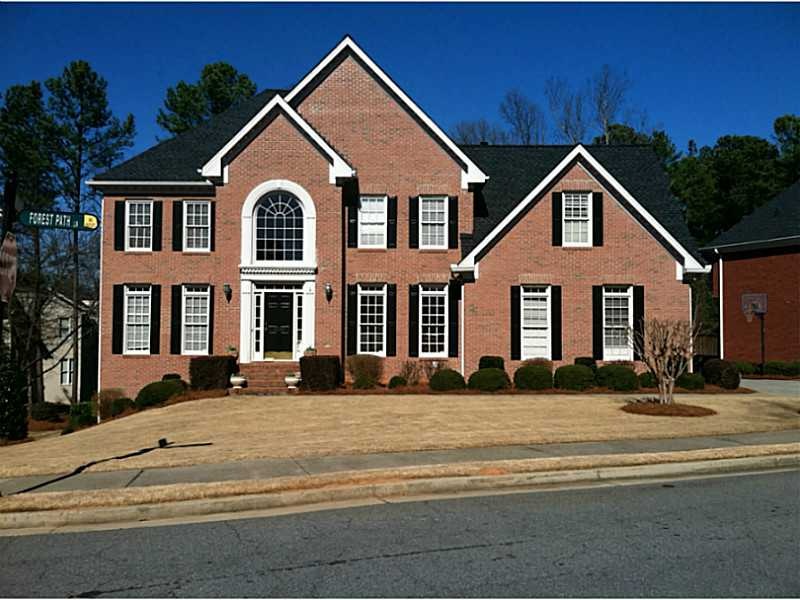 Exterior Front. 3 1/2 Sides Brick w/ Side Entrance