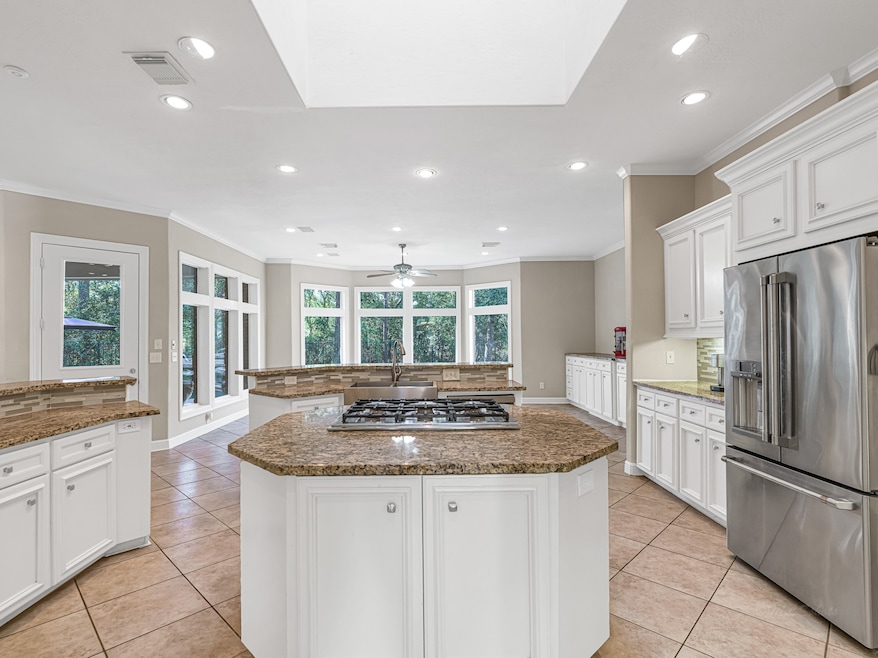 Kitchen features granite countertops, decorative b
