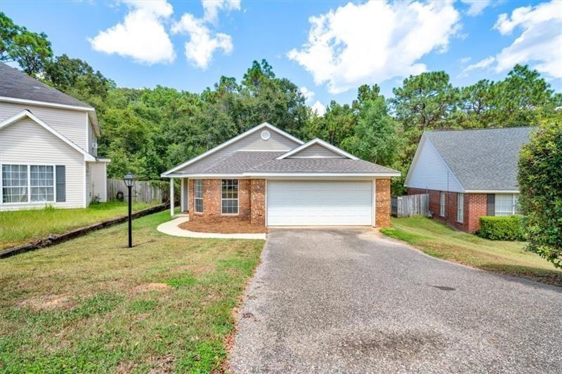 View of front of property with a garage and a fron