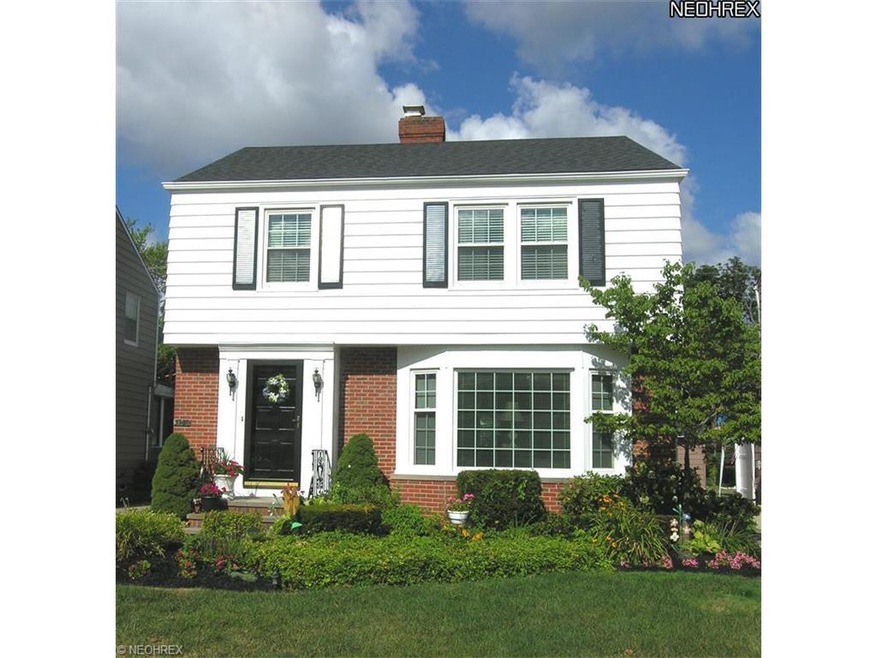 Well kept Colonial with pretty yard.