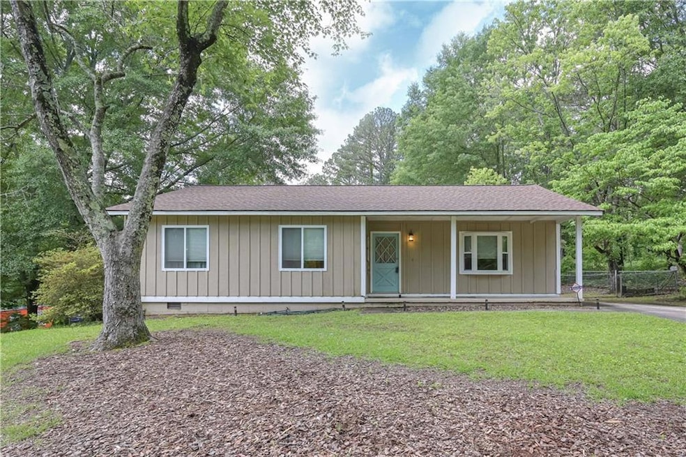 View of front of home featuring roof with shingles