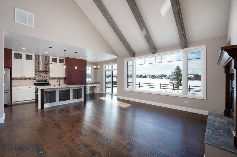 Great Room accented by antique beams with views ac