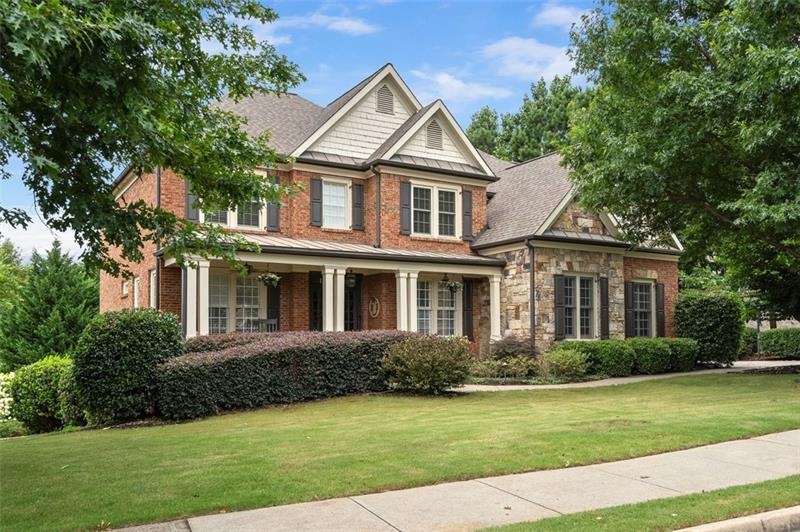 Brick and stone elevation with great porch!