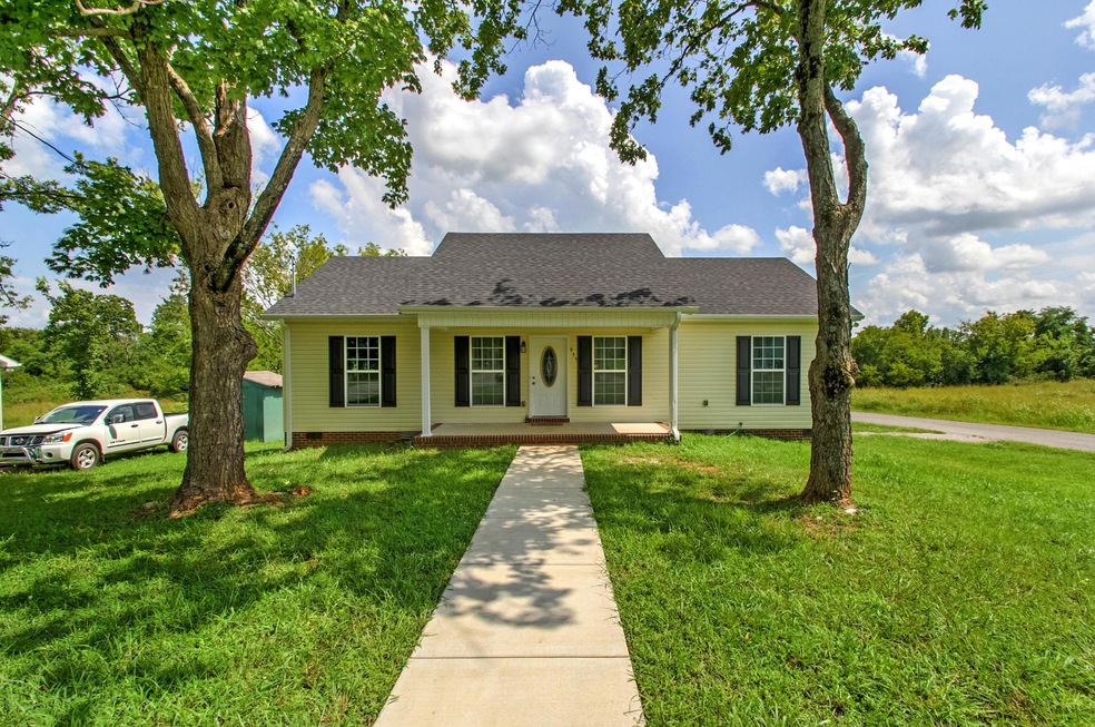 Beautiful home that has mature trees in the front of the home that allows shade