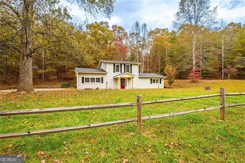 View of front property with a front lawn