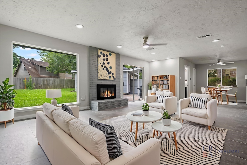 Formal living room adorned with a cozy fireplace a