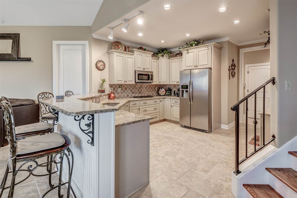Stunning Tuscan Kitchen Open to Spacious Hearth Ro
