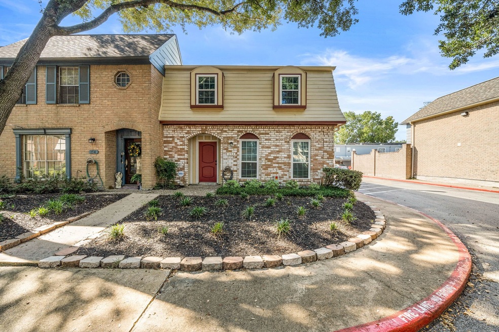 Wonderful corner unit located on tree lined street