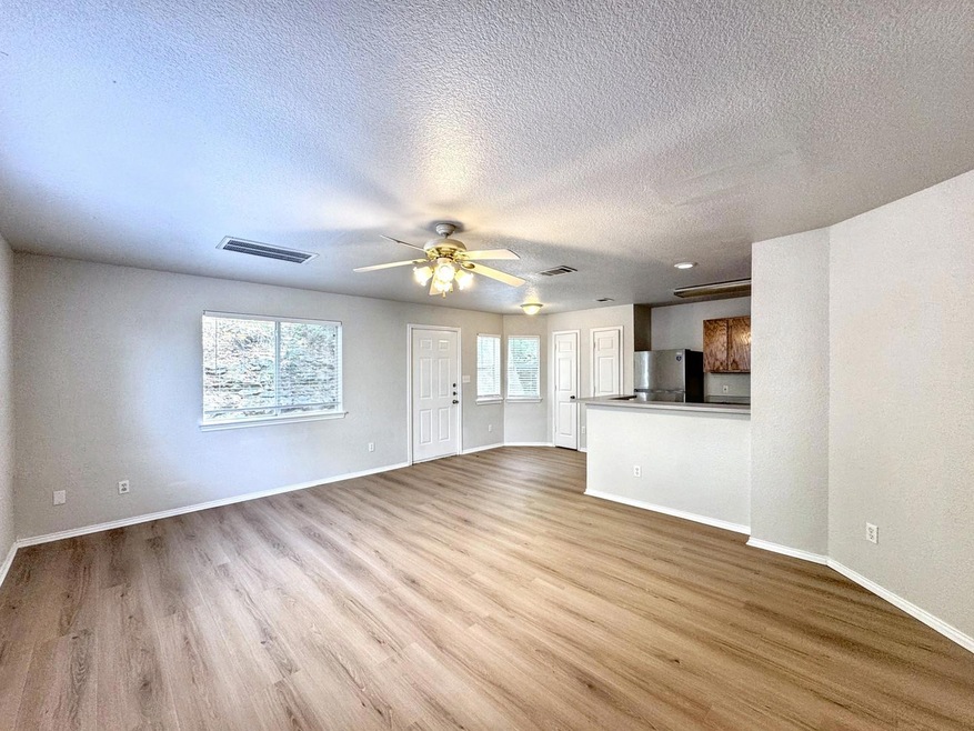 Unfurnished living room with a textured ceiling, 