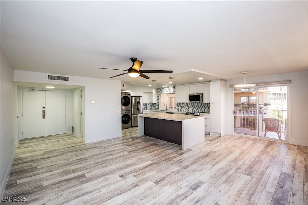 Kitchen featuring light countertops, white cabinet