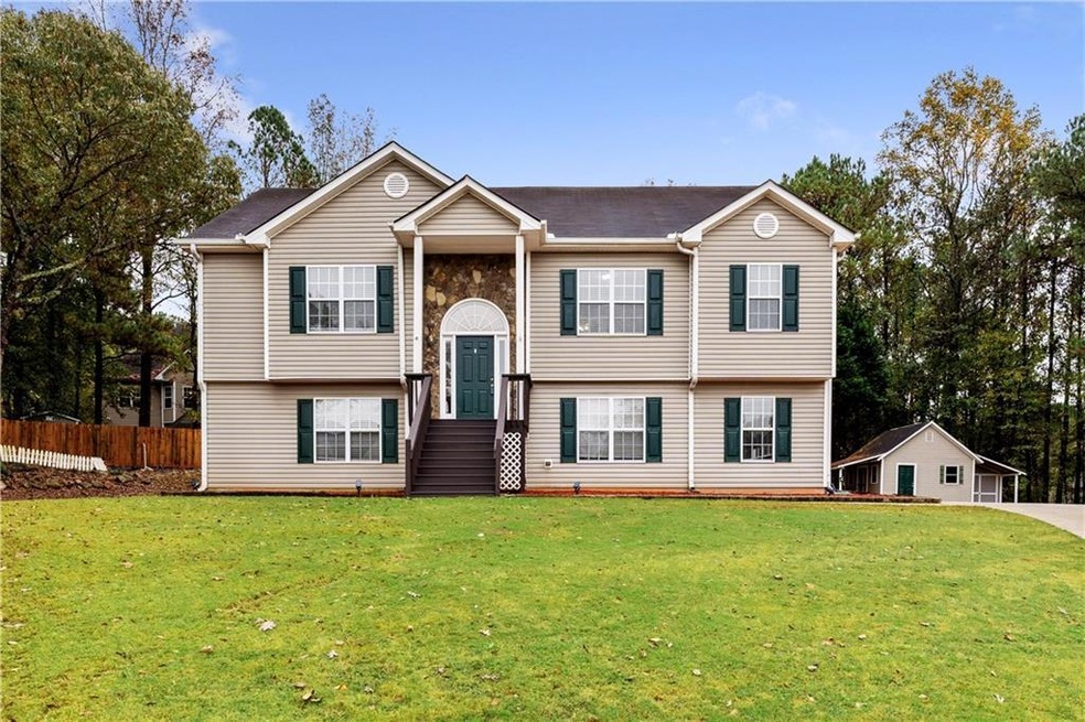 Raised ranch featuring a front lawn