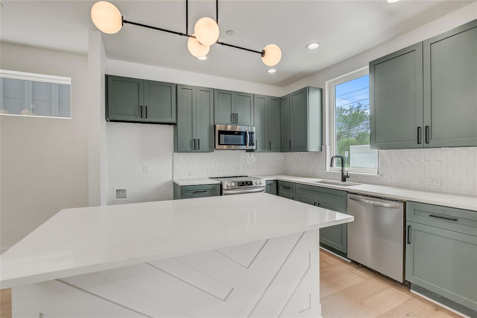 Kitchen featuring appliances with stainless steel