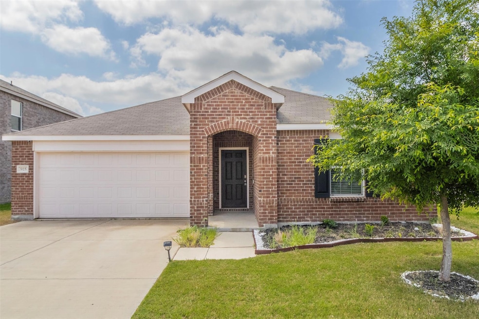 Single story home featuring a front lawn, driveway