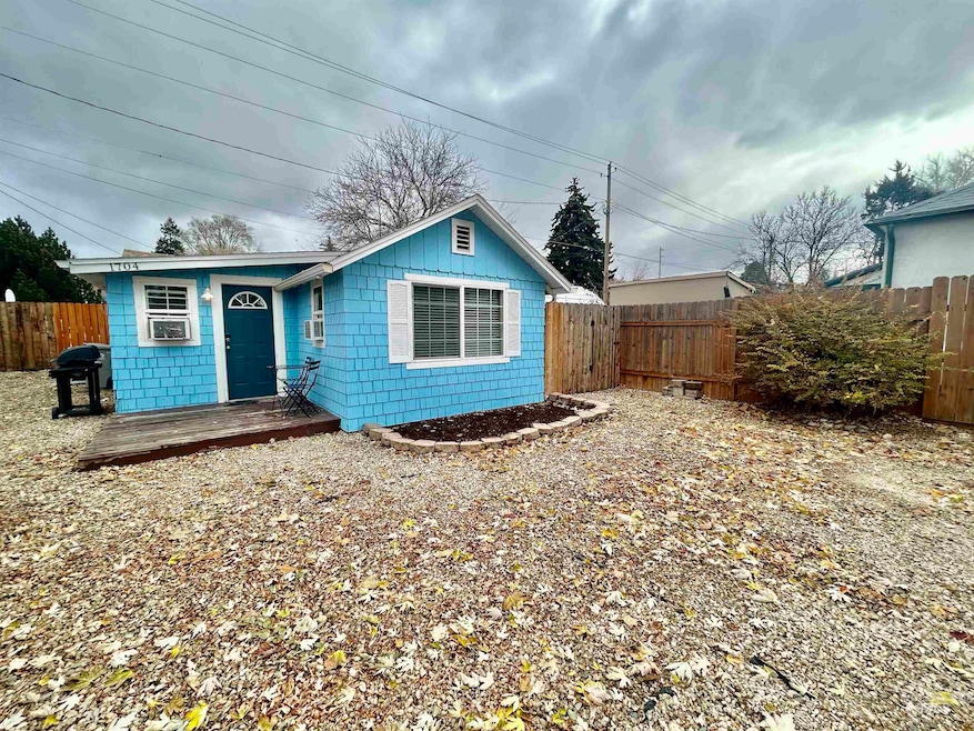 View of front of house with a fenced backyard