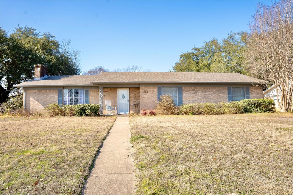 Ranch-style house featuring a front yard