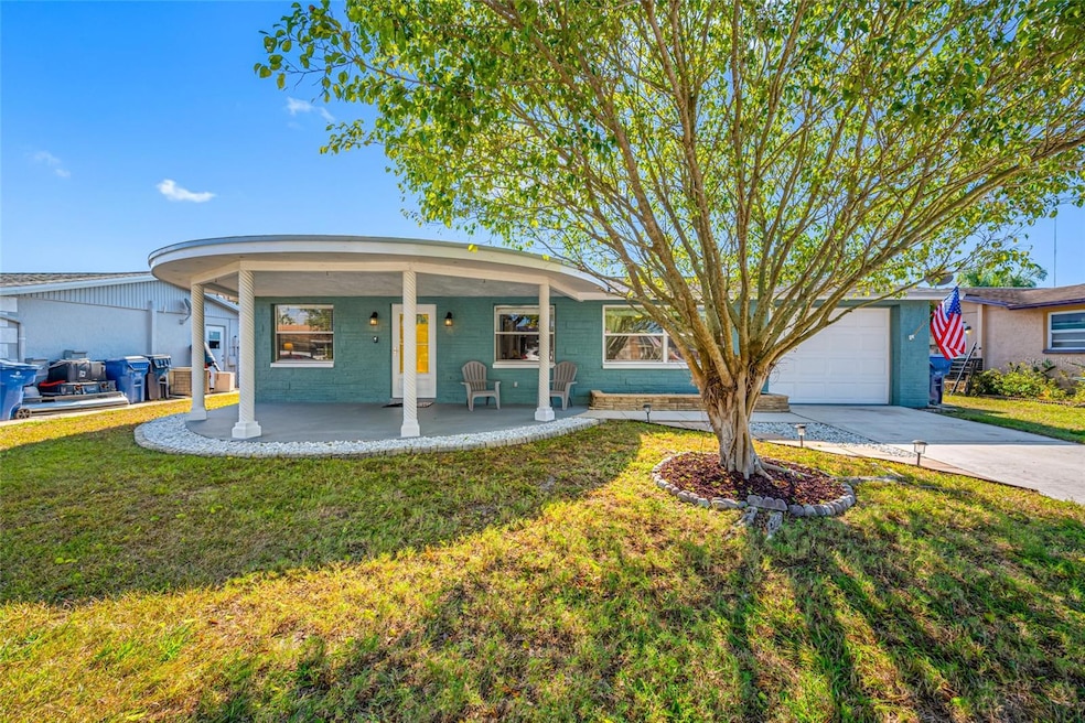 3446 Hoover Dr, Holiday, FL 34691 - photo 1