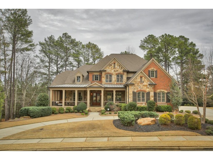 Custom brick and stone home with wide front porch 