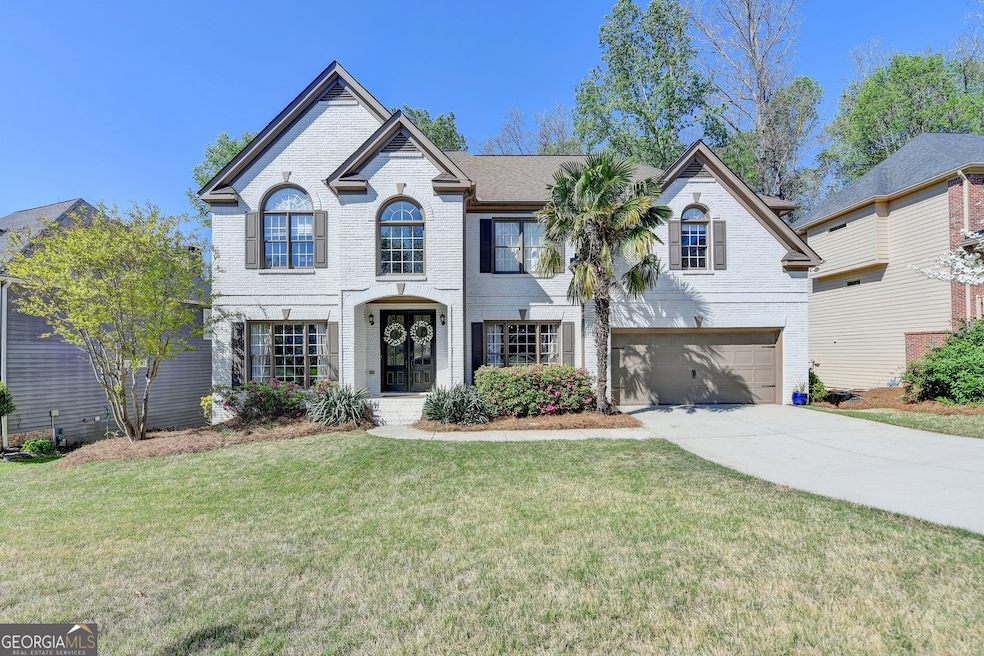 Welcome to this stunning updated painted brick hom