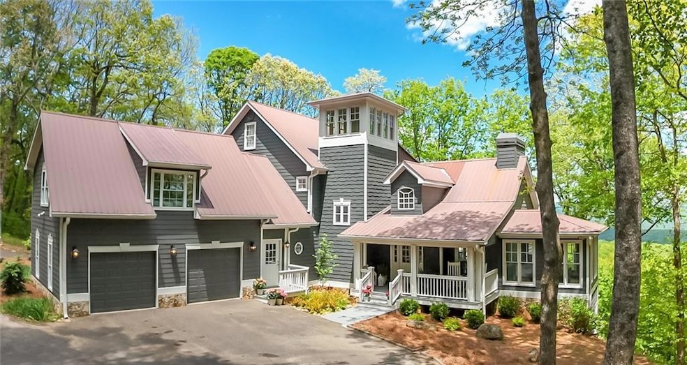 View of front of property with covered porch, asph