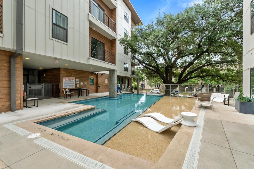 Community pool featuring a patio
