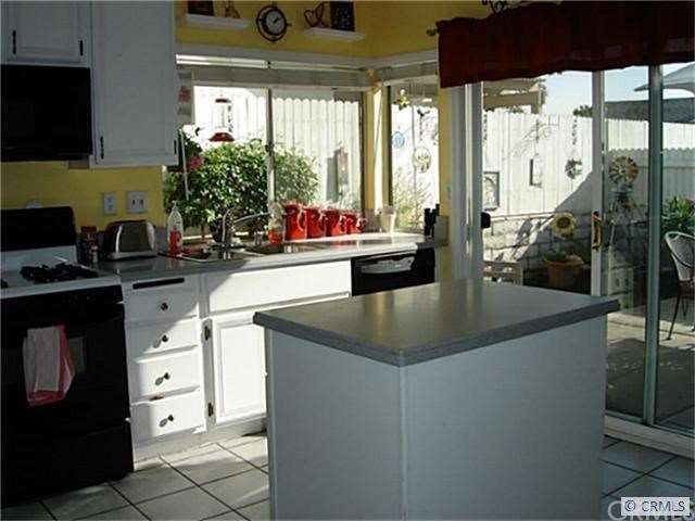 Open Kitchen w/lots of windows.