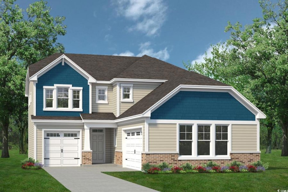 View of front of home with an attached garage, bri