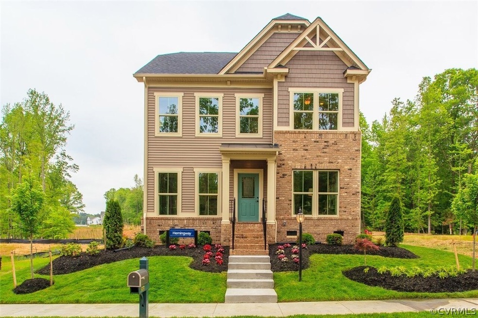Gorgeous brick and vinyl exterior with alley way i