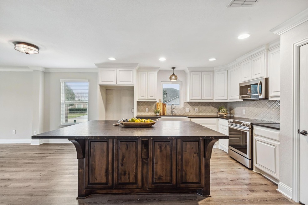 Updated Kitchen with Oversized Island & Leathered Granite Countertops