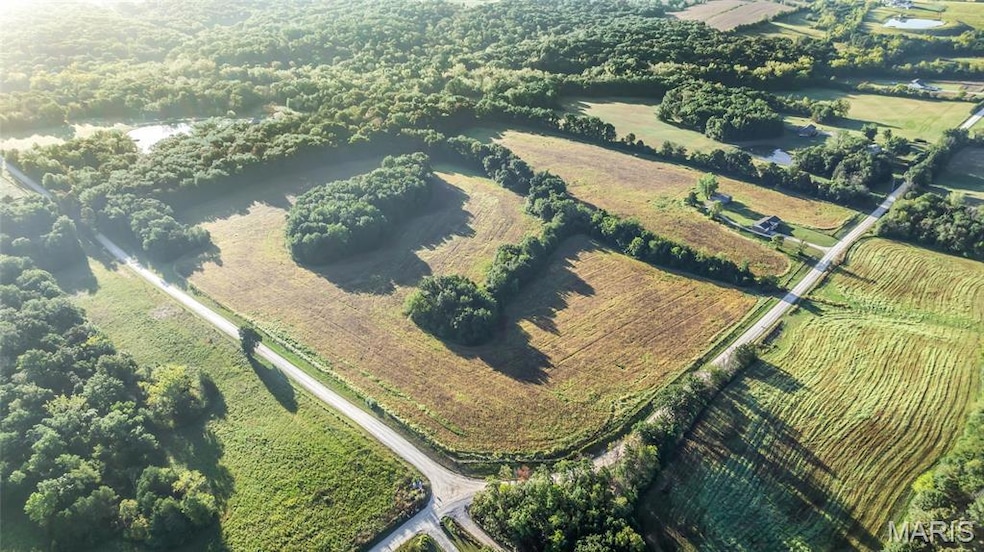 Aerial view of property's location featuring rural landscape