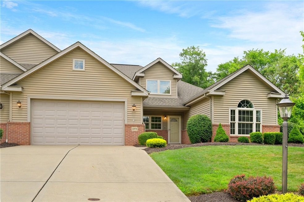 Beautifully manicured curb appeal with mature land