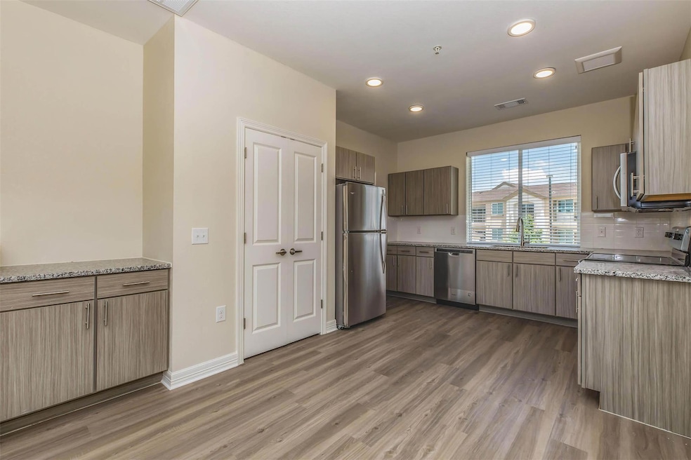 Kitchen featuring visible vents, light wood-style