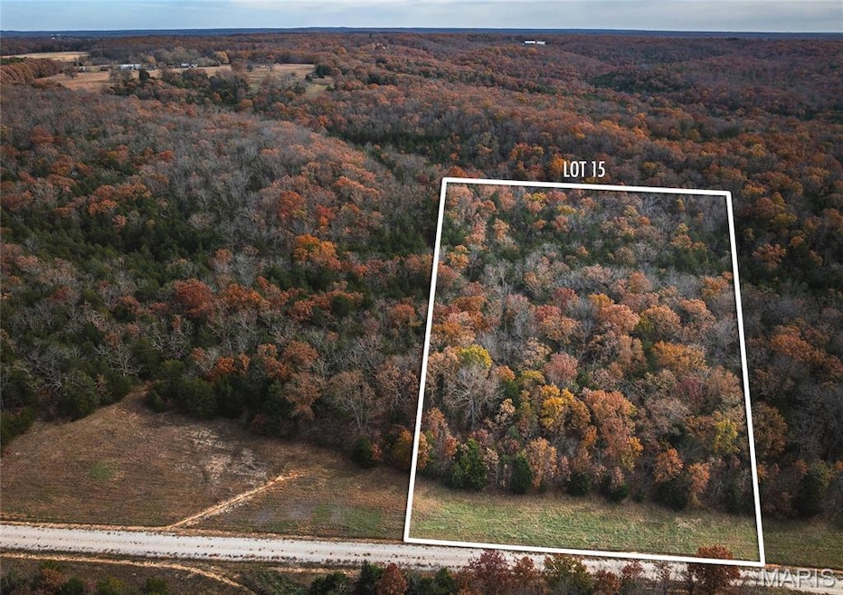 Aerial overview of property's location with property parcel outlined