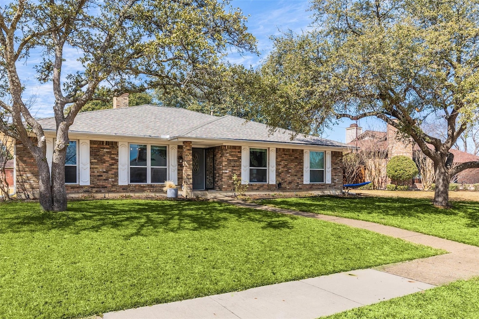 Ranch-style home featuring roof with shingles, a f