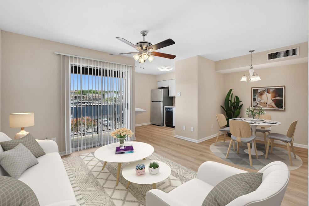 Living area with light wood-style floors, a chand