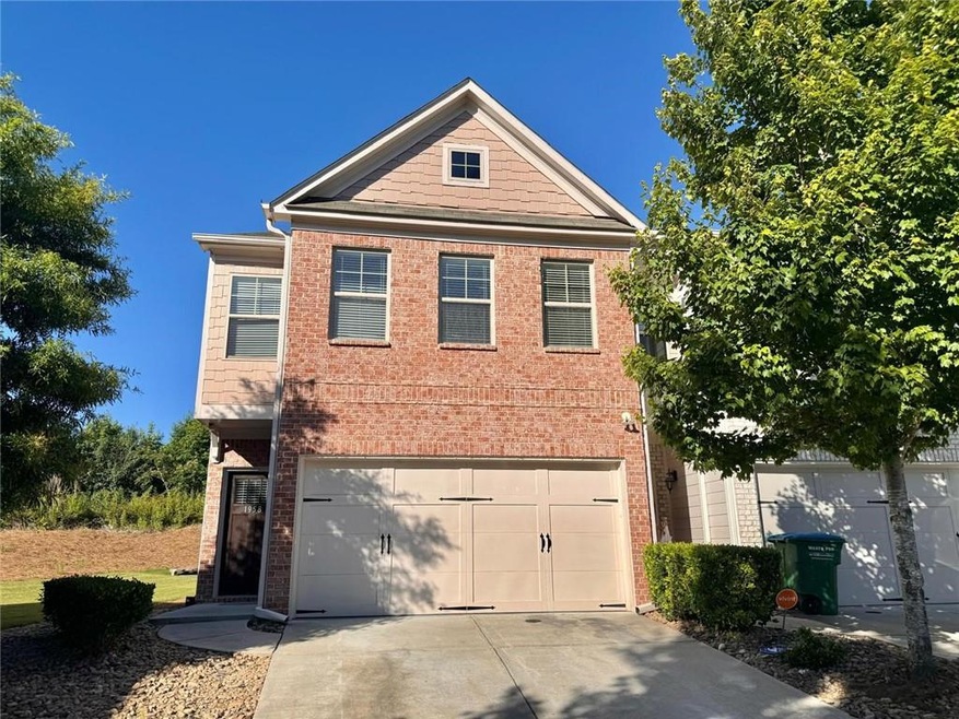 View of front facade featuring a garage
