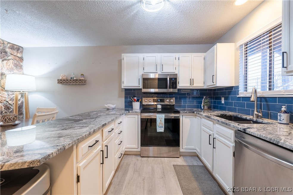 Granite countertops, subway tile backsplash, stain