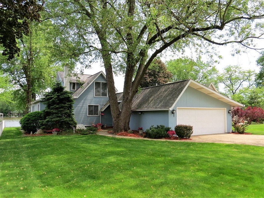 STREET SIDE OF HOME WITH ATTACHED 2.5 CAR GARAGE
