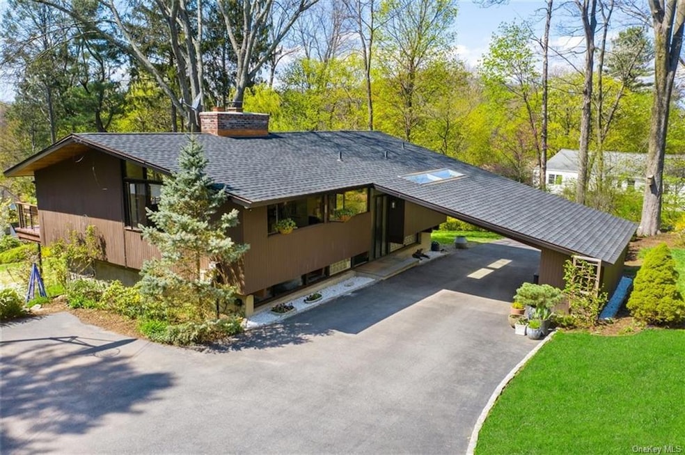 A mid-century house, at the end of a cul-de-sac, o