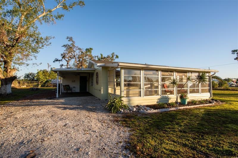 Adorable cottage-like home complete with enclosed front porch/sunroom.