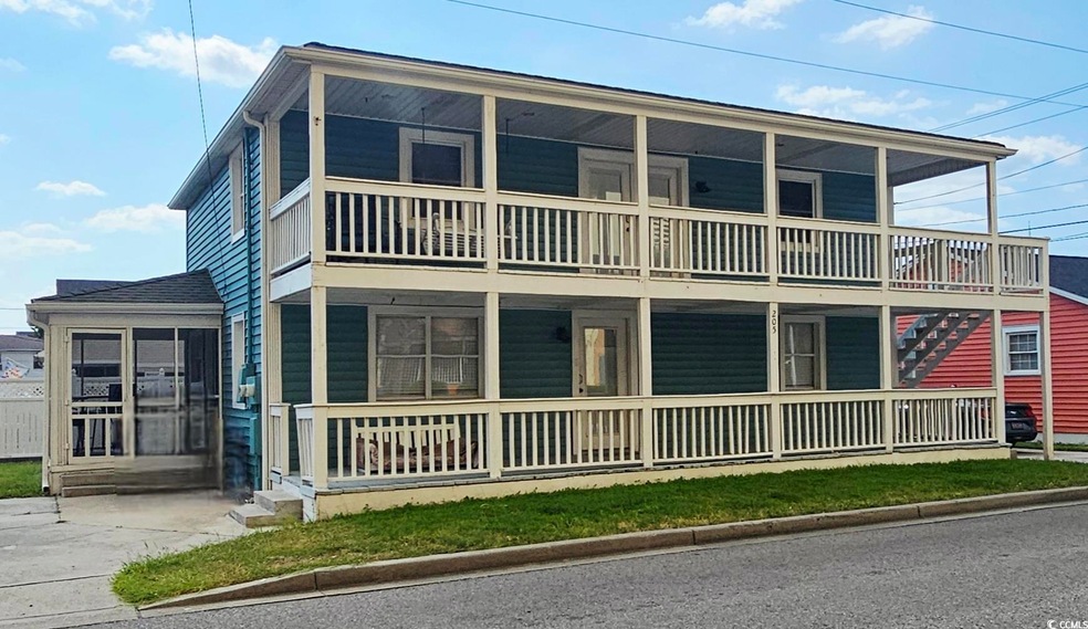View of front of house with a sunroom
