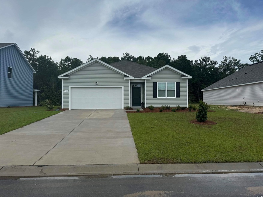 View of front of house featuring a garage and a fr