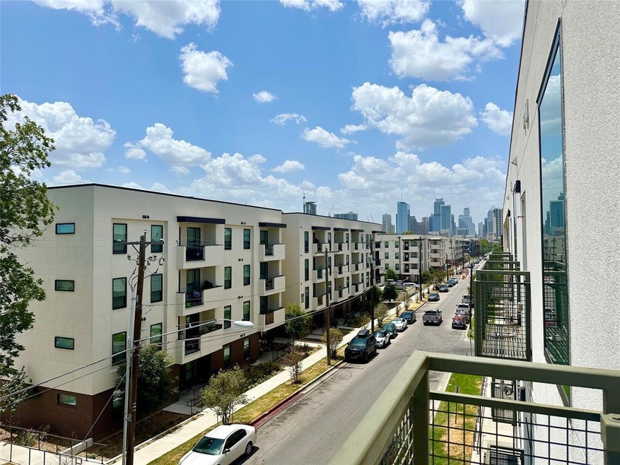Balcony featuring a view of skyline