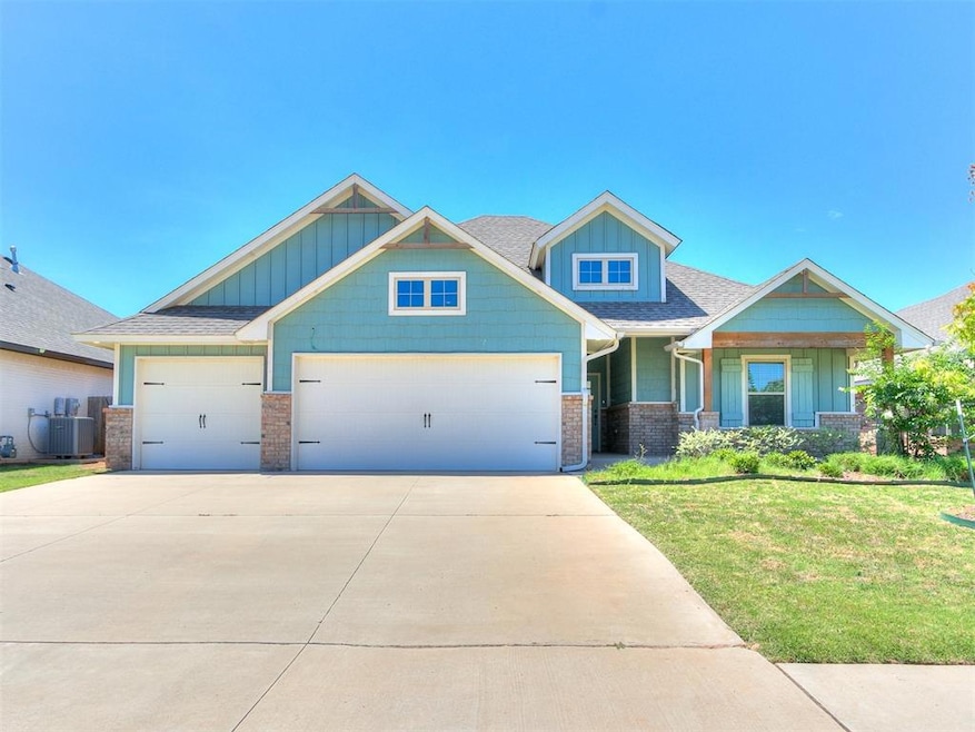 Craftsman-style home with a front yard, a garage, 