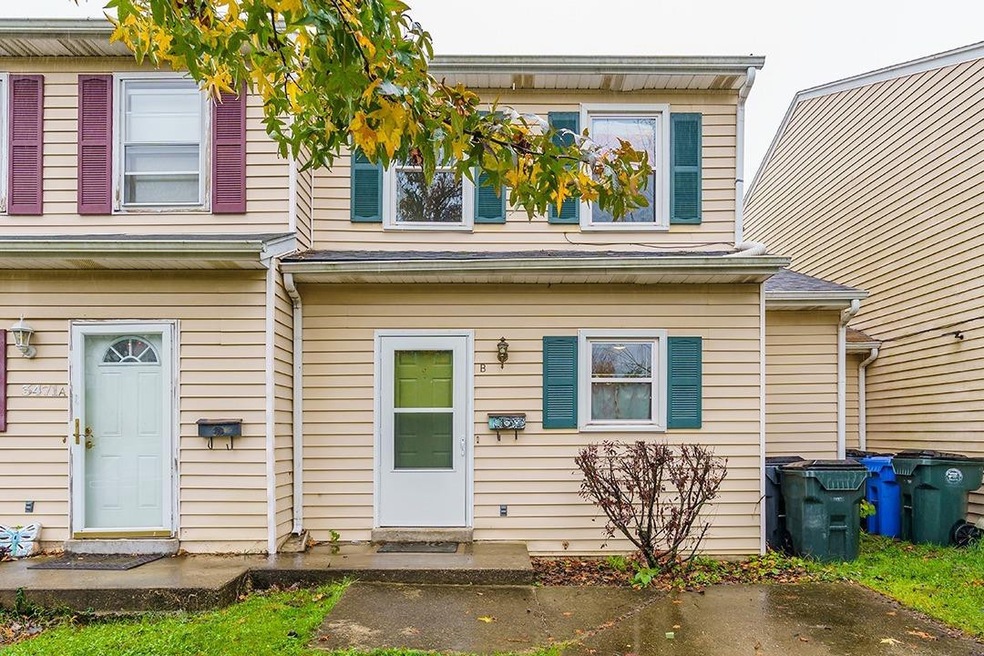 New hunter green shutters highlight the